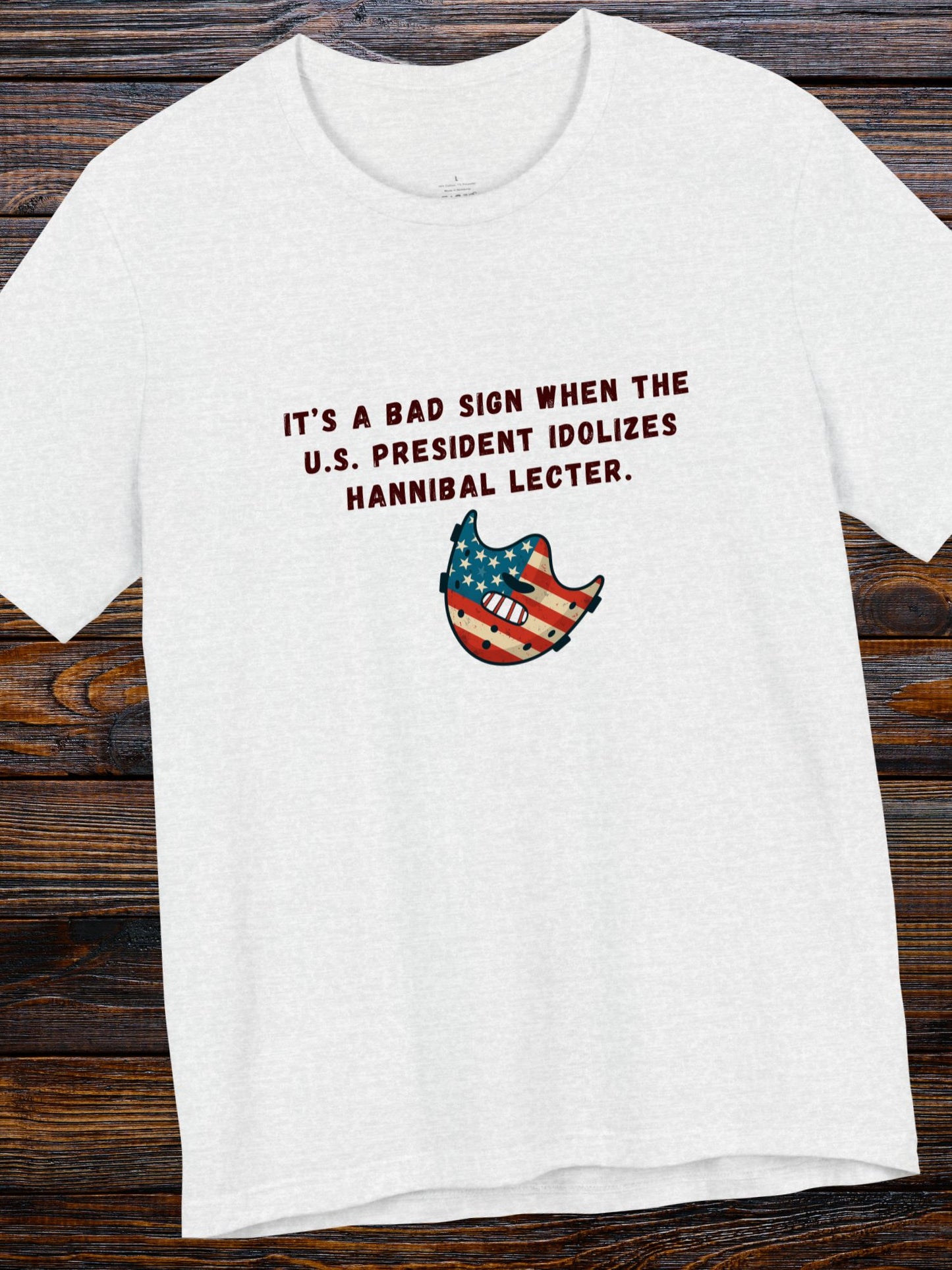 'It’s a Bad Sign When the U.S. President Idolizes Hannibal Lecter.' US Flag Lecter Mask Graphic Unisex T-Shirt, Political Tee