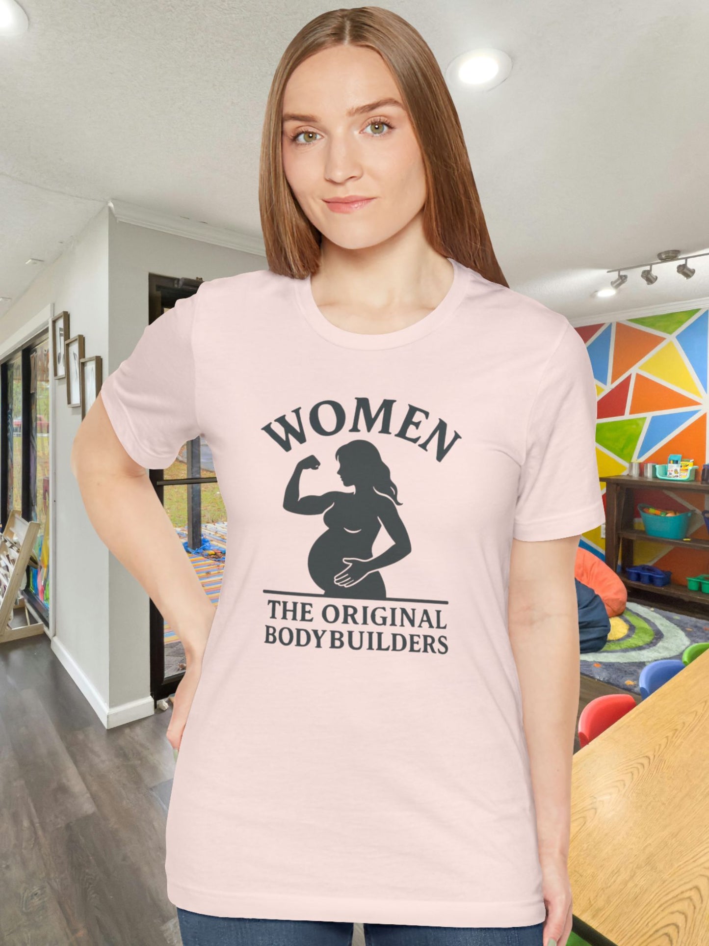 'Women, The Original Bodybuilders' Pregnant Woman Flexing Graphic Unisex T-Shirt, Pregnant Women's Apparel, Strong Women's Tee